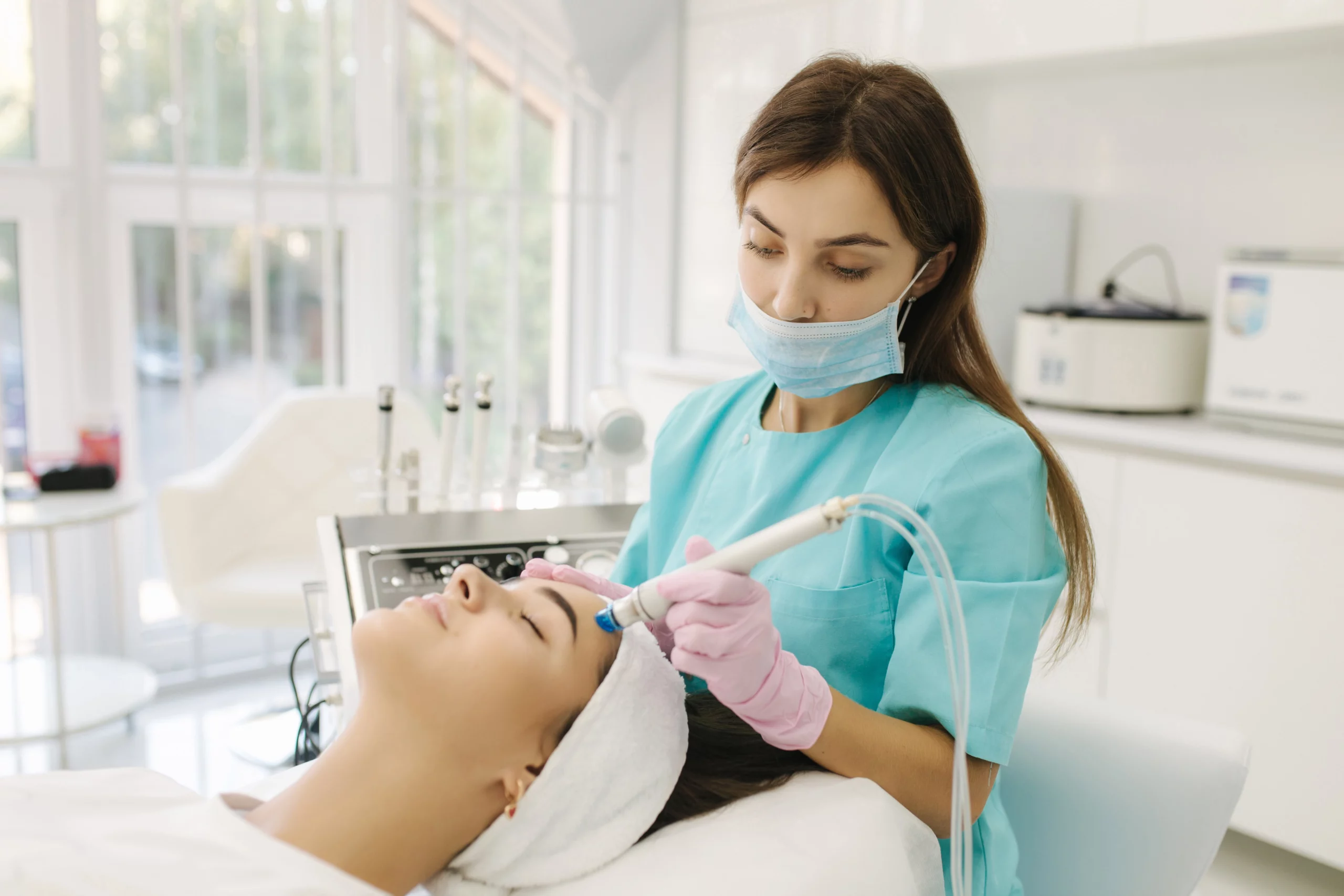 Aesthetician giving Hydrafacial service to patient Outer Banks Dermatology | Nags Head, NC