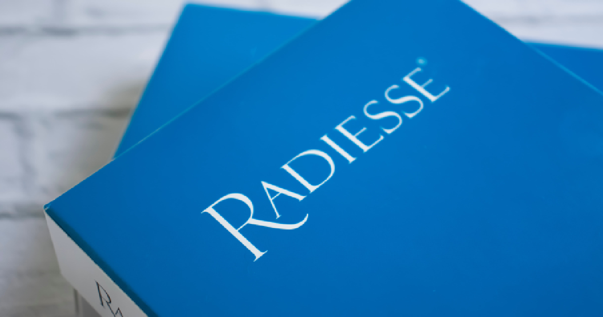 Close-up of a blue Radiesse dermal filler packaging box in NAGS HEAD, NC