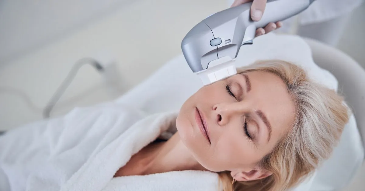 Mature woman receiving Sofwave treatment on her face in Nags Head, NC